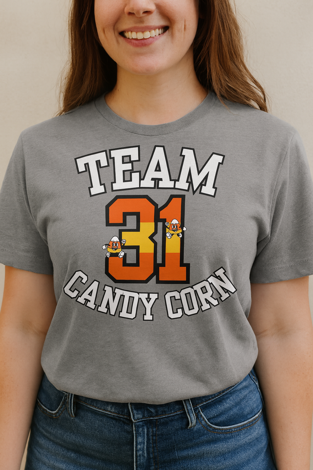 Person wearing a gray t-shirt with 'Team 31 Candy Corn' text and graphics.