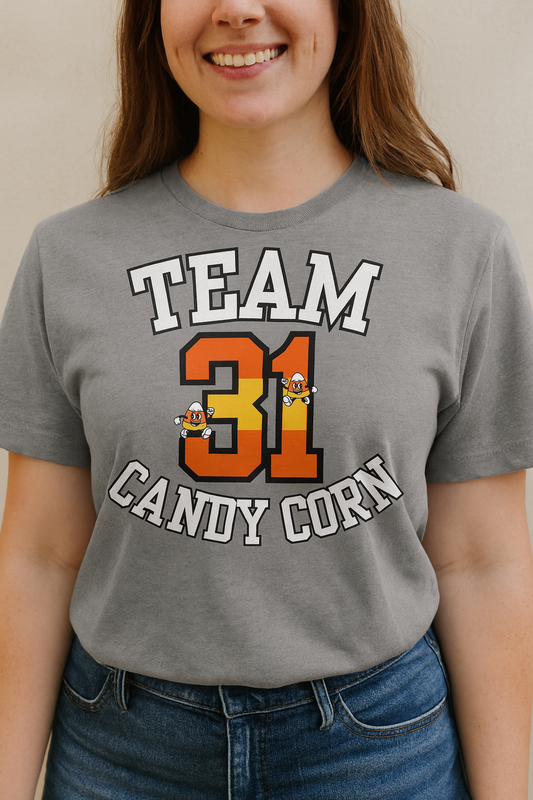 Person wearing a gray t-shirt with 'Team 31 Candy Corn' text and graphics.